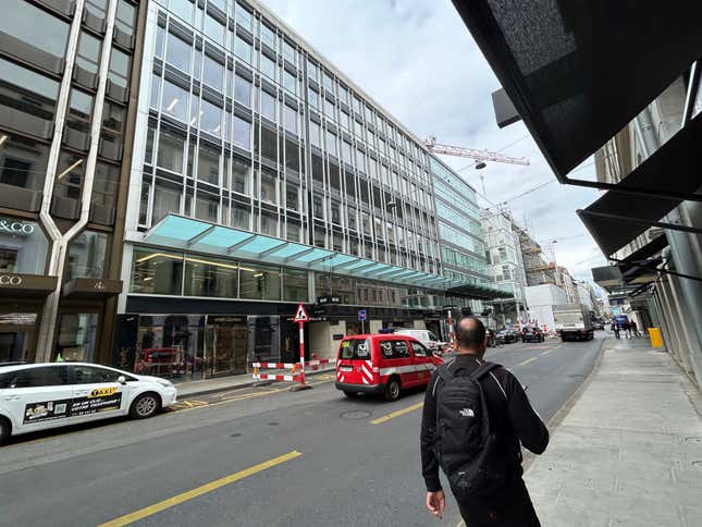 A man walks past the building where is located the Gunvor trading office in Geneva, Switzerland, Wednesday July 26, 2023. Swiss federal prosecutors on Tuesday, Sept. 26, 2023, said they have indicted a former employee of oil trading giant Gunvor over bribes paid to obtain access to the Republic of Congo&#39;s petroleum market more than a decade ago. (AP Photo/Jamey Keaten)