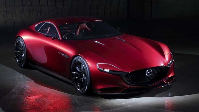 A front-quarter view of a red Mazda RX-Vision concept, seen slightly from above.