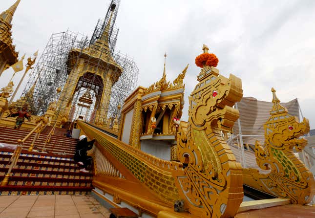 A Thai laborer work on the elaborate complex of the royal crematorium for the late Thai King Bhumibol Adulyadej's funeral ceremony at Sanam Luang, near the Grand Palace in Bangkok, Thailand, 12 October 2017. The royal cremation of King Bhumibol Adulyadej is scheduled on 26 October 2017, which has been declared a national public holiday for 2017, the peak of more than a year of official mourning. The funeral will consist of five-day rites from 25 to 29 October. King Bhumibol died at the age of 88 in Siriraj hospital on 13 October 2016, after 70 years on the throne. EPA-EFE/NARONG SANGNAK