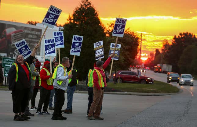 File - UAW local 862 members strike outside of Ford&#39;s Kentucky Truck Plant in Louisville, Ky. on Oct. 12, 2023. In each new contract between the United Auto Workers union and General Motors, Ford and Stellantis, parts of the companies&#39; secret long-term plans for new vehicles are exposed. (Michael Clevenger/Courier Journal via AP, File)