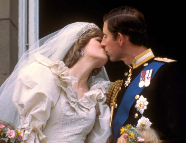Britain's Prince Charles kisses his bride, the former Diana Spencer, on the balcony of Buckingham Palace in London, after their wedding on July 29, 1981. (AP Photo)