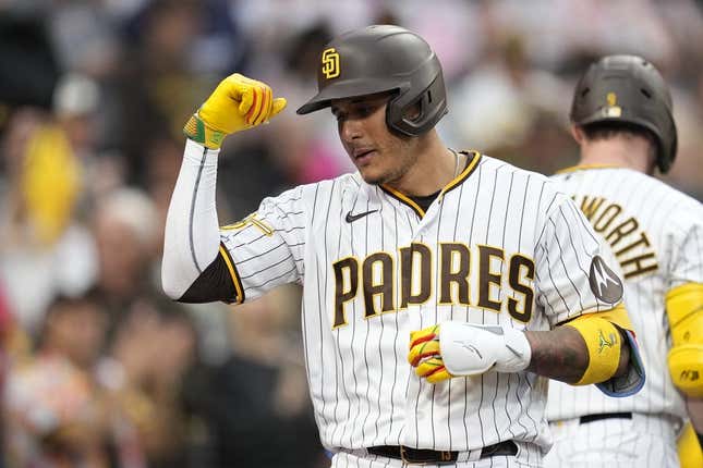 San Diego Padres third baseman Manny Machado, right, walks on the