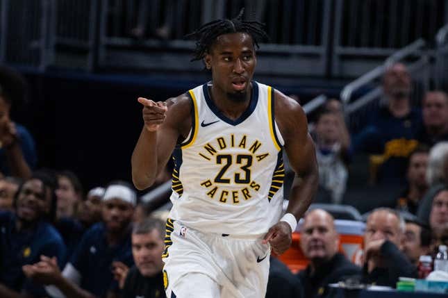 Oct 16, 2023; Indianapolis, Indiana, USA; Indiana Pacers forward Aaron Nesmith (23) celebrates a made three point basket in the second quarter against the Atlanta Hawks at Gainbridge Fieldhouse.