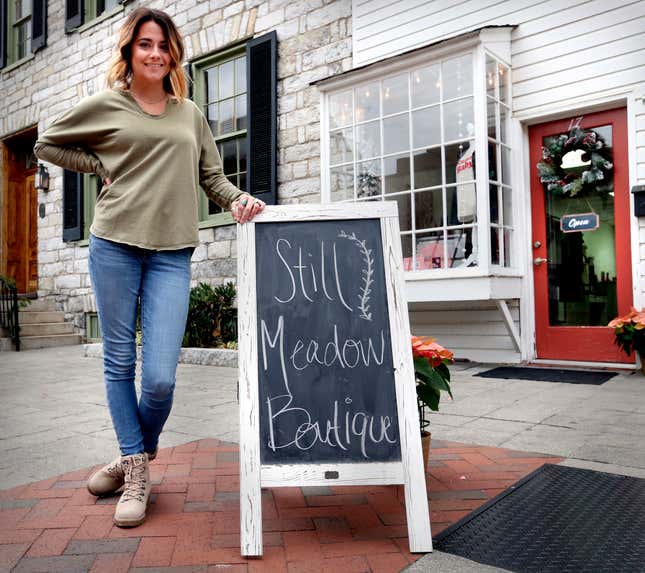 FILE - Lacey Larrick poses outside the Still Meadow Boutique, Dec. 17, 2021, in Winchester, Va. Larrick&#39;s business started in 2019 with a website and a few social media channels selling women&#39;s clothing. Record numbers of people are starting new businesses, and more and more of them are women and minorities, according to a new study. (Jeff Taylor/The Winchester Star via AP, File)