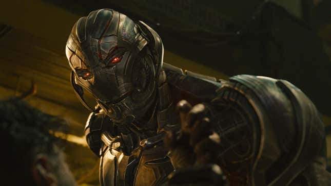 Ultron towers over someone with a threatening expression.