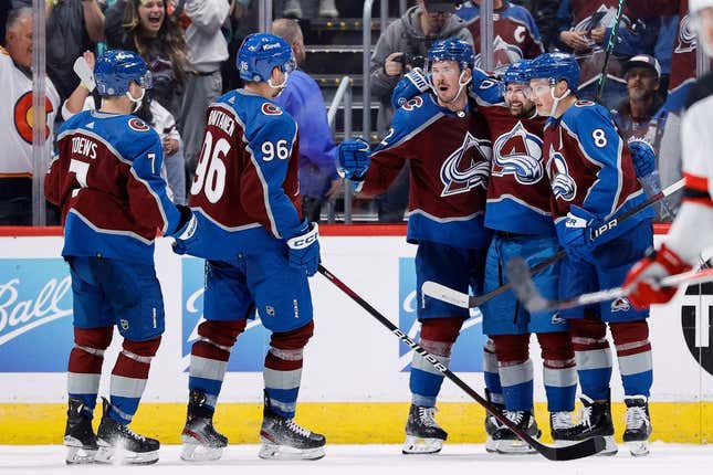 Nov 7, 2023; Denver, Colorado, USA; Colorado Avalanche center Ryan Johansen (12) celebrates his goal with left wing Tomas Tatar (90) and defenseman Cale Makar (8) and right wing Mikko Rantanen (96) and defenseman Devon Toews (7) in the third period against the New Jersey Devils at Ball Arena.