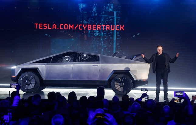 File - Tesla CEO Elon Musk introduces the Cybertruck at Tesla&#39;s design studio on Nov. 21, 2019, in Hawthorne, Calif. The windows were broken during a demonstration intended to show the strength of the glass. Musk is expected to give an update on manufacturing problems with the long-awaited Cybertruck at an event Thursday marking the first deliveries of the futuristic, angular pickup truck. (AP Photo/Ringo H.W. Chiu)