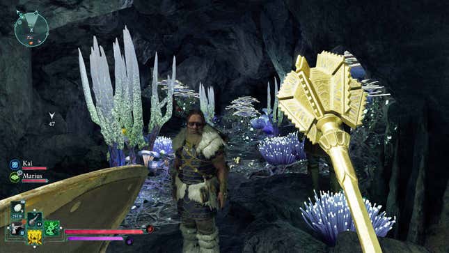 A mighty golden mace held in front of Marius in a dark cave.