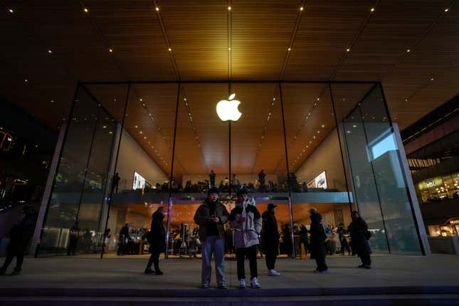 Shopper stand watch as people visit an Apple Store at an outdoor shopping mall in Beijing on Saturday, Dec. 23, 2023. It was tumultuous 2023 for the Chinese economy. Some of the world&#39;s biggest brands said they were weighing, or already have decided, to shift manufacturing away from China amid unease about security controls, government protection of their Chinese rivals and Beijing&#39;s wobbly relations with Washington. But there was at least one bright spot for Beijing amid all the tough news about declining foreign investment: American fast food companies have announced a surge of investment in a market of 1.4 billion people. KFC, McDonald&#39;s and Starbucks are among companies in recent months that have announced plans for major investment in China. (AP Photo/Andy Wong)