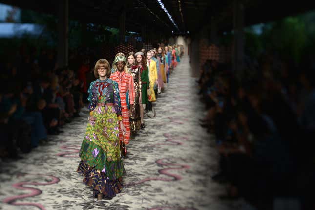 PICTURE TAKEN WITH A TILT AND SHIFT LENS - Models present creations for fashion house Gucci during the women Spring / Summer 2016 Milan's Fashion Week on September 23, 2015 in Milan. AFP PHOTO / TIZIANA FABI (Photo credit should read TIZIANA FABI/AFP/Getty Images)