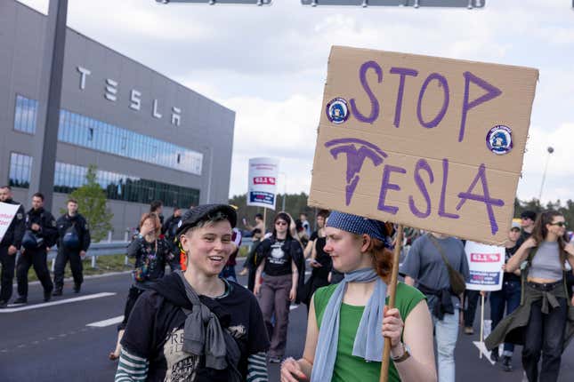 On May 11, 2024, environmental activists will protest outside the Tesla Gigafactory Electric Car Factory near Gruenheide in Germany.