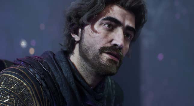 Gustave looks at something off-screen.