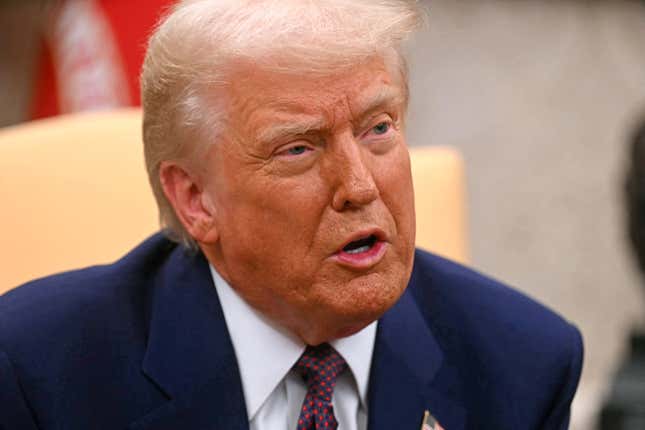 US President Donald Trump meets with unseen Indian Prime Minister Narendra Modi, in the Oval Office of the White House in Washington, DC, on February 13, 2025. 