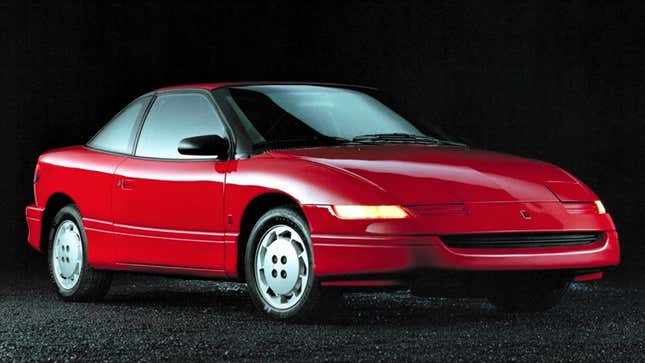 A photo of a red Saturn SC2 sports car. 