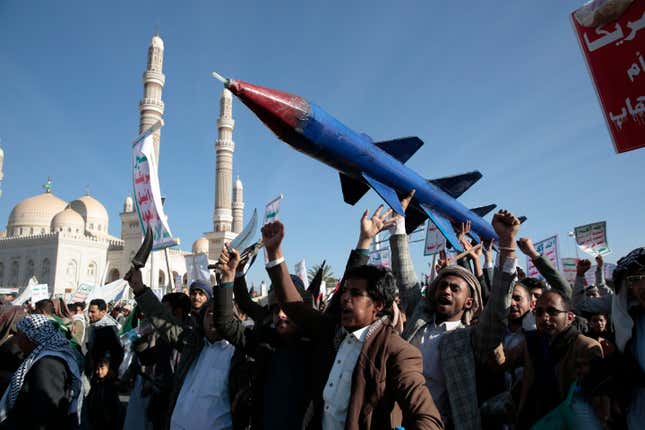 Houthi supporters attend a rally in support of the Palestinians in the Gaza Strip and against the U.S.-led airstrikes on Yemen, in Sanaa, Yemen, Friday, Jan. 26, 2024. (AP Photo/Osamah Abdulrahman)