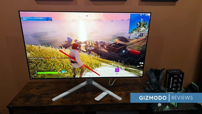 OLED with Fortnite playing on top of a TV stand.