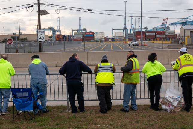 Dockworkers strike outside of the Port of Newark after members of the International Longshoremen’s Association, or ILA, began walking off the job after 12:01 a.m. ET on Oct. 1 in Elizabeth, New Jersey. 