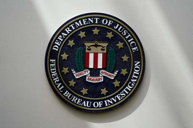 FILE - An FBI seal is seen on a wall on Aug. 10, 2022, in Omaha, Neb. The House was holding a key test vote Wednesday, April 10, 2024, on whether to consider a bill that would reauthorize a crucial national security surveillance program, but the prospects were uncertain amid intense Republican opposition as well as an edict earlier in the day from former President Donald Trump to “kill&quot; the measure. Johnson has called the program “critically important” but has struggled to find a path forward on the issue, which has been plagued by partisan bickering for years. (AP Photo/Charlie Neibergall, File)