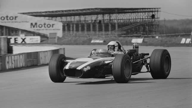 A photo of Ludovico Scarfiotti racing an F1 car. 