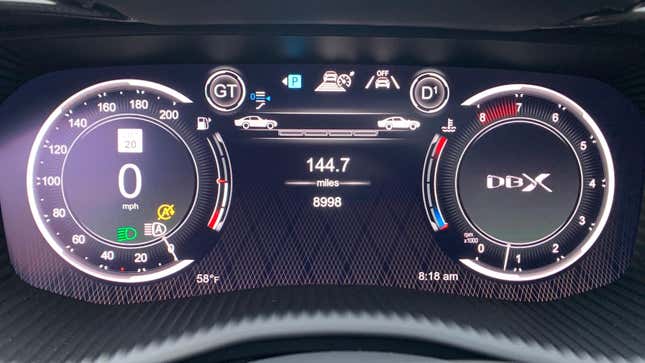 close-up of the instrument panel on a 2023 Aston Martin DBX 707, showing the speedometer, tachometer, and the distance gauge for the Adaptive Cruise Control, which features two icons shaped like a classic Aston Martin DB5