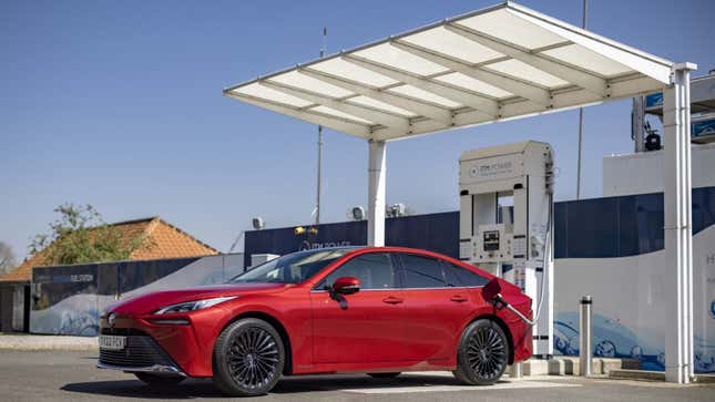 A photo of a Toyota Mirai at a hydrogen filling station.