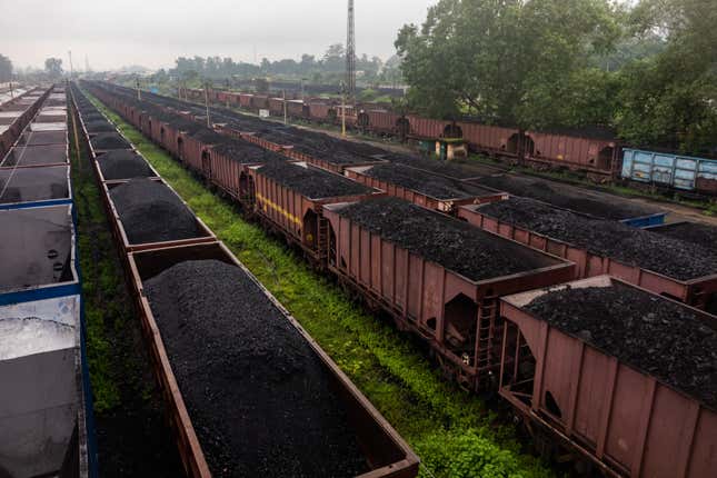 Wagons loaded with coal wait at the yards in Korba Railway Station.