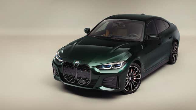 A photo of a dark green BMW i4 electric sedan. 