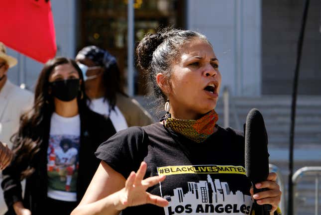 In this Aug. 5, 2020 file photo, Melina Abdullah speaks during a Black Lives Matter protest at the Hall of Justice in downtown Los Angeles. Authorities say three teenagers driven by racial hatred were behind hoax calls that brought major police responses to the home of Abdullah, a leading Black Lives Matter activist in Los Angeles.