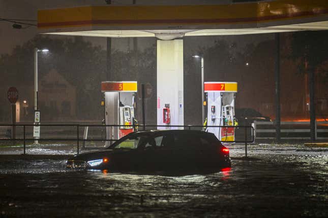 business new tamfitronics A vehicle is stranded on a water-flooded street after Hurricane Milton made landfall in Brandon, Florida