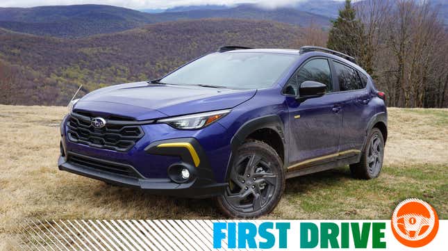 A blue 2024 Subaru Crosstrek Sport.