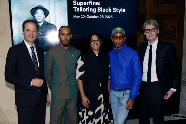 NEW YORK, NEW YORK - OCTOBER 09: Max Hollein, Lewis Hamilton, Monica Miller, Pharrell Williams, and Andrew Bolton attend a press conference announcing the Spring 2025 Costume Institute exhibition “Superfine: Tailoring Black Style” at Metropolitan Museum of Art on October 09, 2024 in New York City.