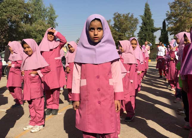 Iranian and Afghan girls gather at the Emam Hasan Mojtaba school in Kerman, Iran.