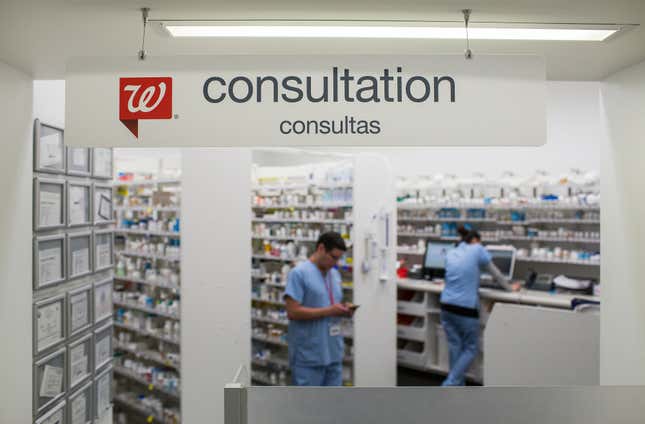 A “Consultation” sign at the pharmacy window inside a Walgreens in Los Angeles, California.