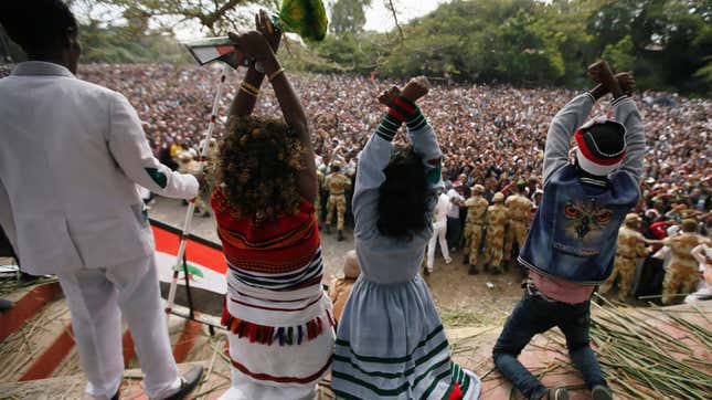Demonstrators chant slogans while flashing the Oromo protest gesture during Irreecha, the thanksgiving festival of the Oromo people, in Bishoftu town, Oromia region, Ethiopia, October 2, 2016.