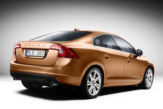 Orange Volvo S60 rear-quarter view