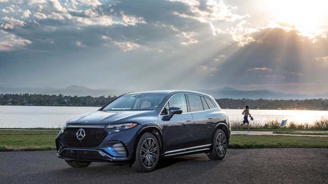 A photo of a blue Mercedes-Benz EQS SUV in the sun. 