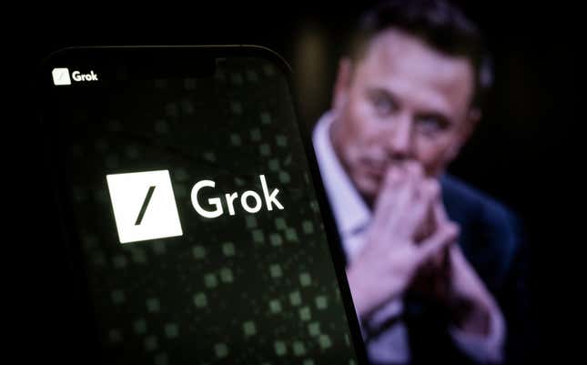 xAI and Grok logos displayed on a smartphone screen, a photo of Elon Musk is behind it