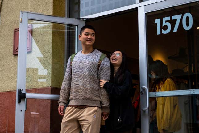 Shoppers emerge from a store, Tuesday, March 14, 2023, in Las Vegas. (AP Photo/Ty O&#39;Neil)