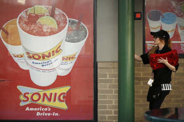 A carhop walks inside a Sonic restaurant in Knoxville, Tennessee. 