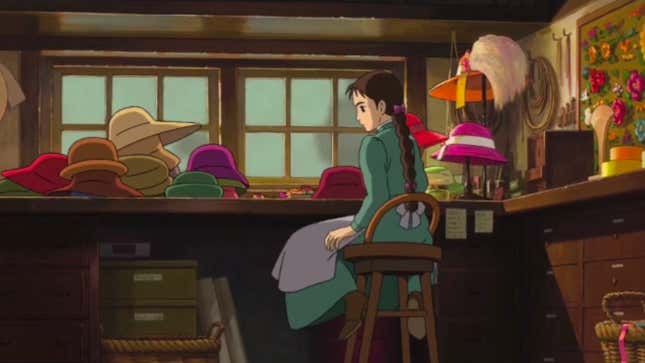 Star of Hayao Miyazaki's adaptation of Howl's Moving Castle, Sophie, sits on a stool looking at some of the hats she still has to work on.