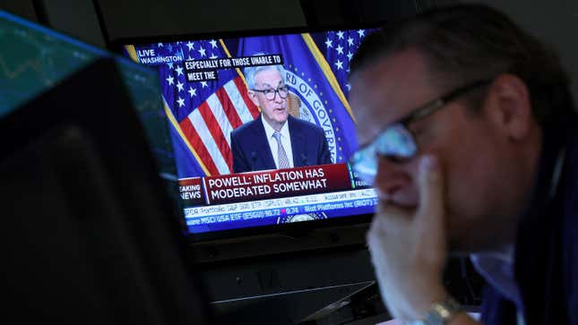 Traders react as Federal Reserve Chair Jerome Powell is seen delivering remarks on a screen, on the floor of the New York Stock Exchange (NYSE) in New York City, U.S., May 3, 2023.