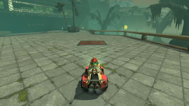Bowser Jr. sits in a kart in front of a question mark panel.