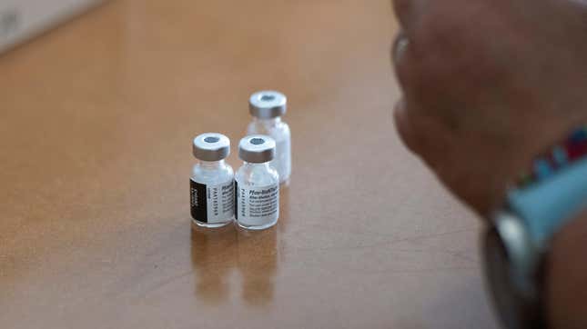 A health care worker in South Africa preparing vials of the Pfizer/BioNTech vaccine. 