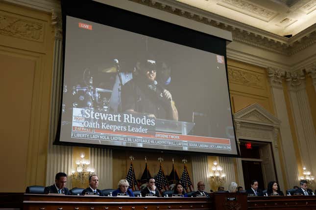 Oath Keepers founder Stewart Rhodes appears on a video screen above members of the Select Committee to Investigate the January 6th Attack on the U.S. Capitol during the seventh hearing on the January 6th investigation in the Cannon House Office Building on July 12, 2022, in Washington, DC. The bipartisan committee, gathering evidence for almost a year related to the January 6 attack at the U.S. Capitol, is presenting its findings in a series of televised hearings. On January 6, 2021, supporters of former President Donald Trump attacked the U.S. Capitol Building during an attempt to disrupt a congressional vote to confirm the electoral college win for President Joe Biden.