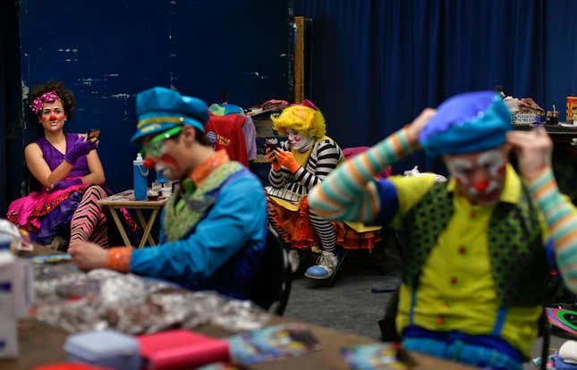 Clowns take a break between acts in “Clown Alley,” a private area backstage, May 5.