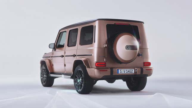 Rear 3/4 view of a rose gold Mercedes-Benz G-Class