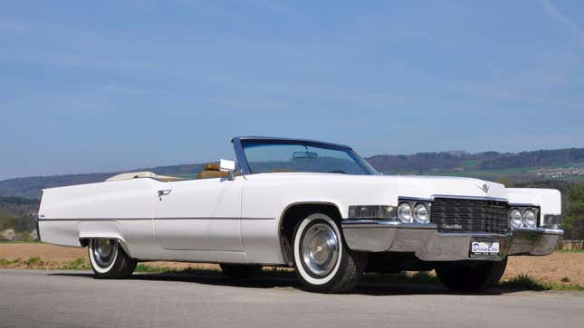 A photo of a white Cadillac De Ville 