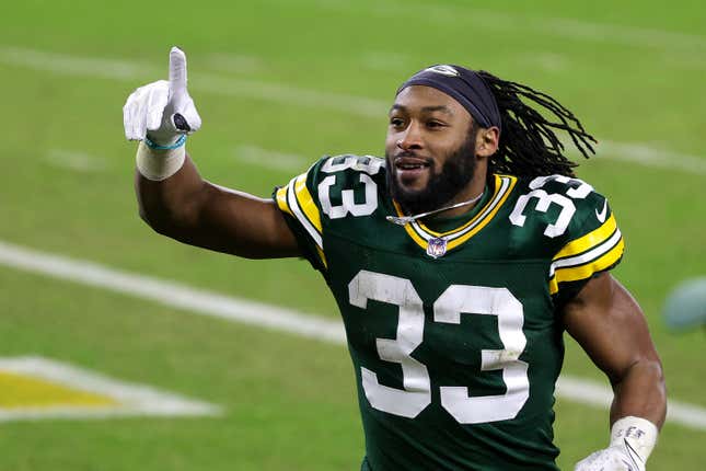 Aaron Jones #33 of the Green Bay Packers reacts after defeating the Los Angeles Rams 32-18 in the NFC Divisional Playoff game at Lambeau Field on January 16, 2021 in Green Bay, Wisconsin. 