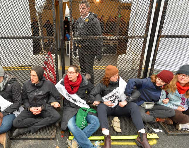 Protesters block an entry point before the inauguration.