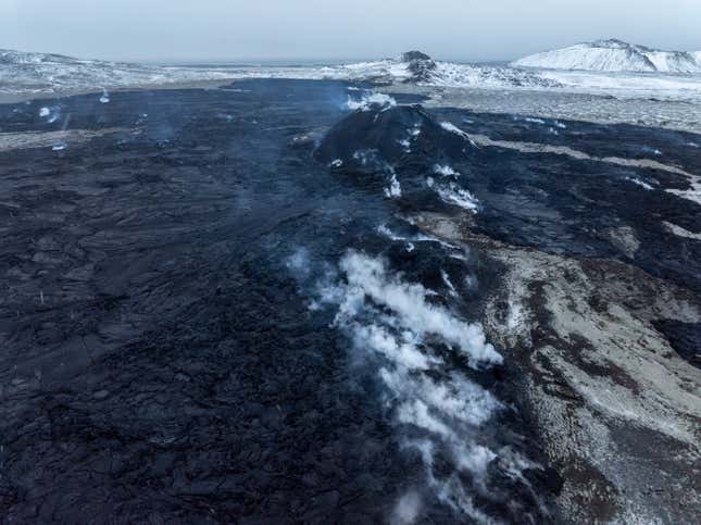 A view of the still steaming fissure from above, in Grindavik on Iceland&#39;s Reykjanes Peninsula, Thursday, Dec. 21, 2023. (AP Photo/Marco Di Marco)